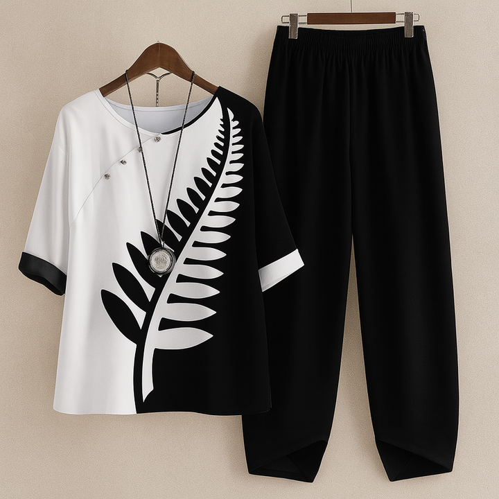 Two Piece Women Leaf Print Top | Tapered Trousers and Short Sleeves in Black#colour_black