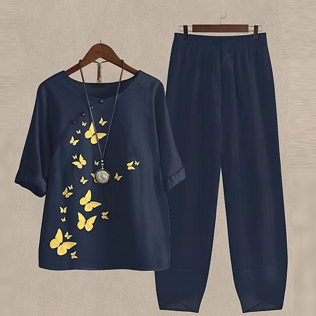 Two Piece Women Leaf Print Top | Tapered Trousers and Short Sleeves in Navy#colour_navy